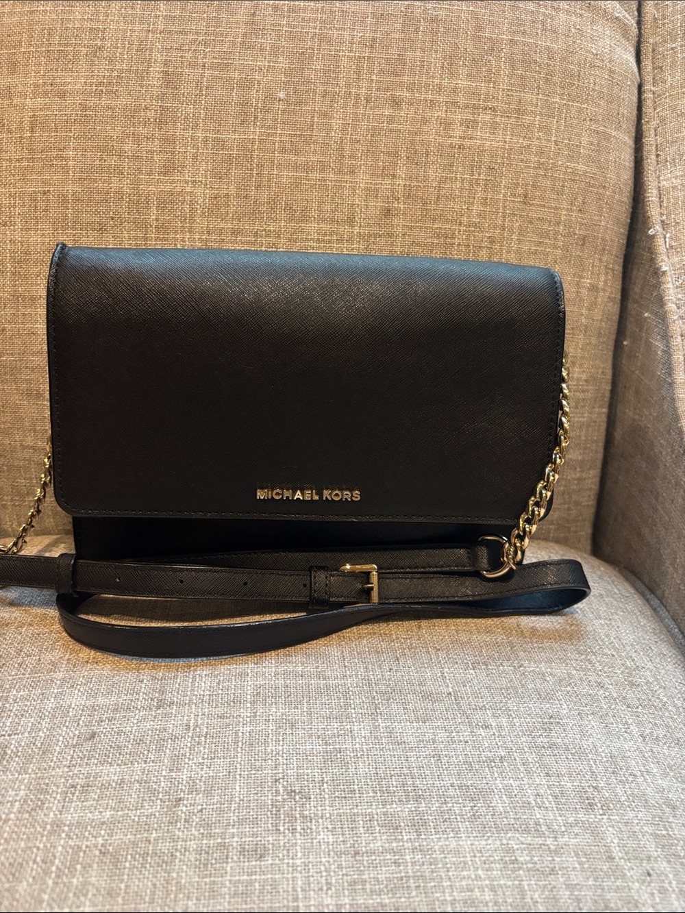 Micheal Kors black leather and chain strap crossbody bag.